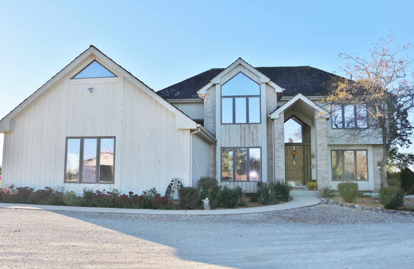 12232 Grove Road Minooka, IL 60447 - Photo 2 of 57 a front view of a house with a yard and garage