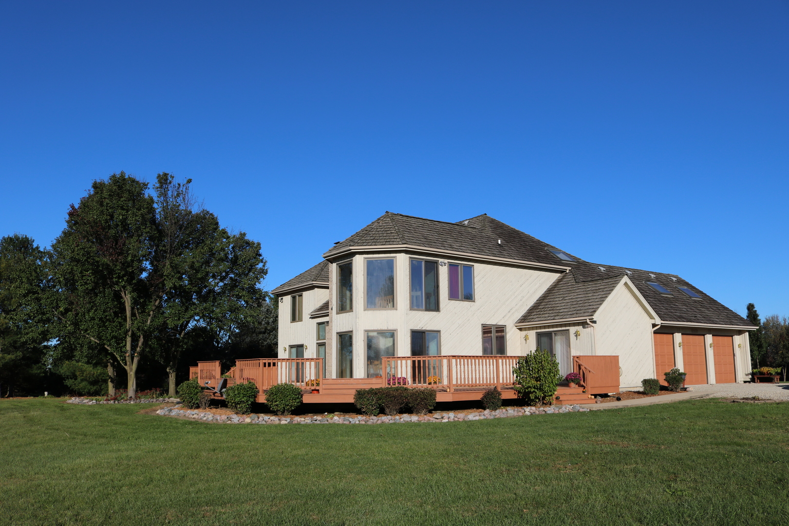 12232 Grove Road Minooka, IL 60447 - Photo 17 of 57 a front view of a house with a garden