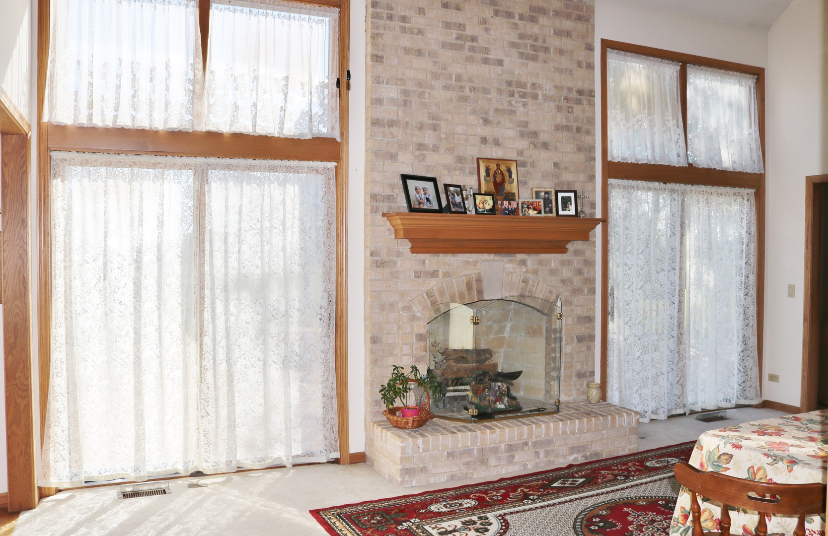 12232 Grove Road Minooka, IL 60447 - Photo 20 of 57 a living room with fireplace furniture and a window