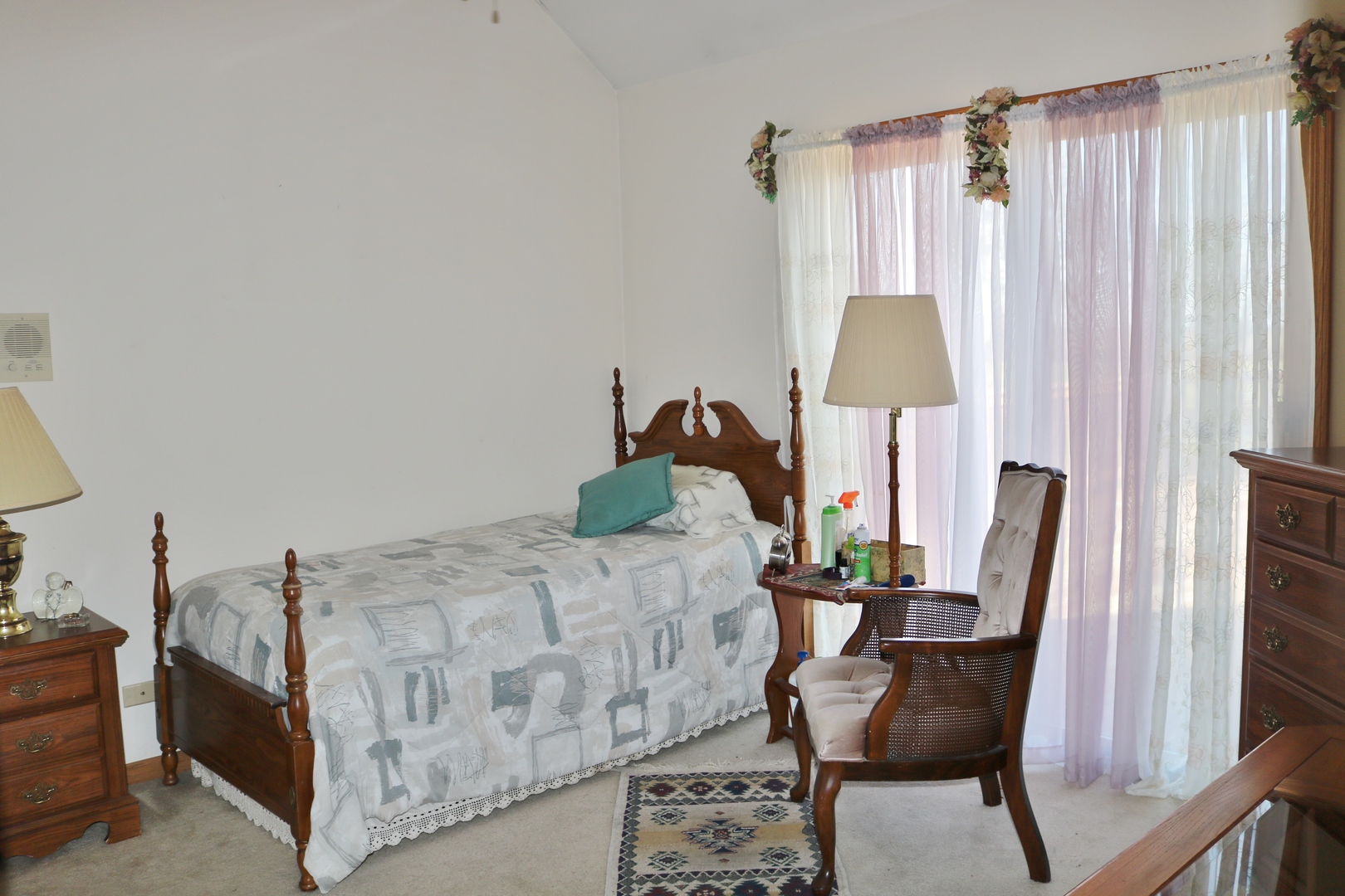 12232 Grove Road Minooka, IL 60447 - Photo 30 of 57 a bedroom with a bed and a chair