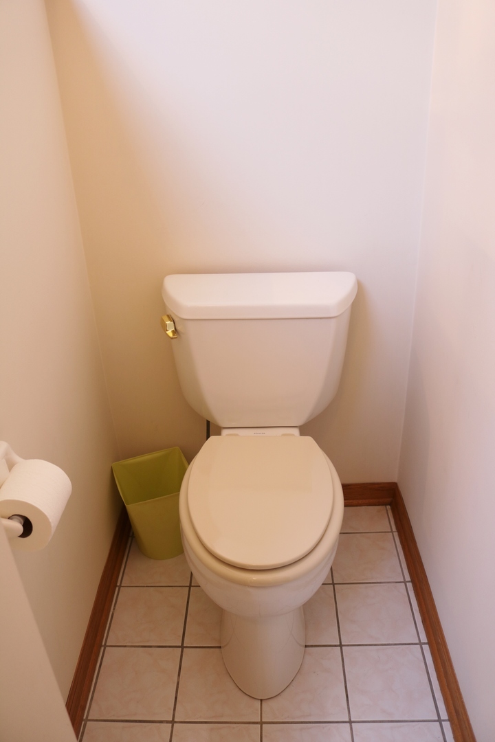 12232 Grove Road Minooka, IL 60447 - Photo 36 of 57 a white toilet sitting next to a white sink