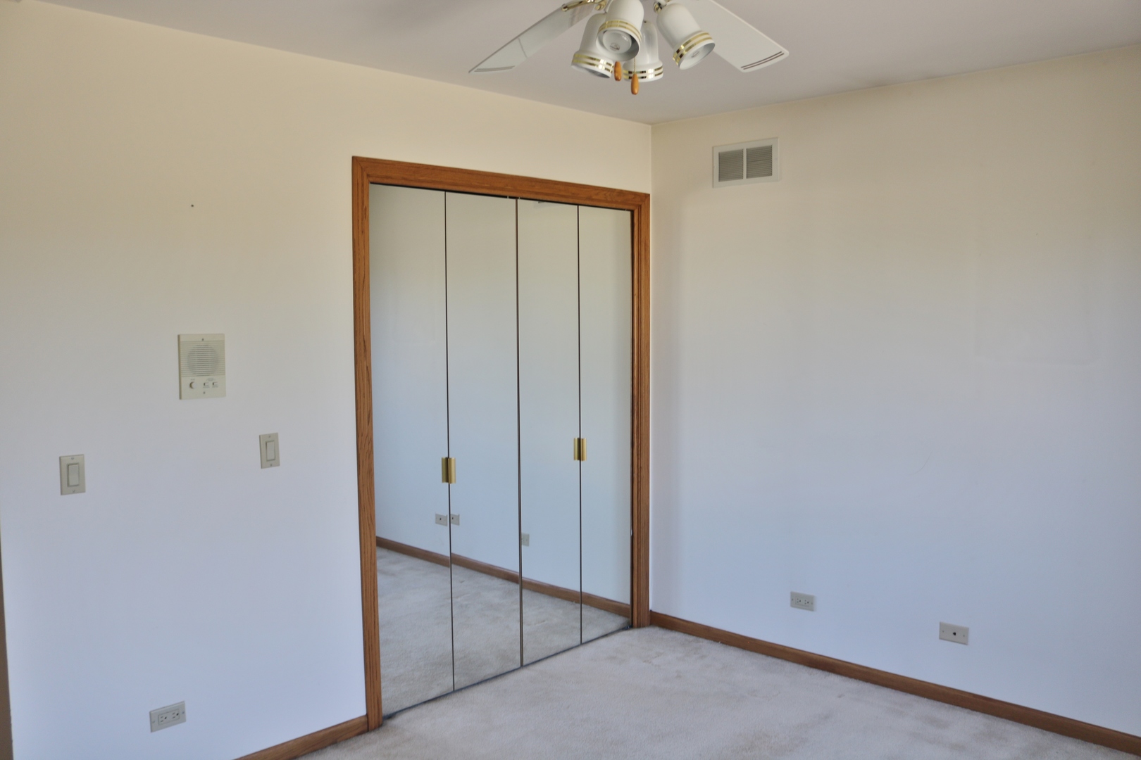 12232 Grove Road Minooka, IL 60447 - Photo 42 of 57 an empty room with a chandelier fan