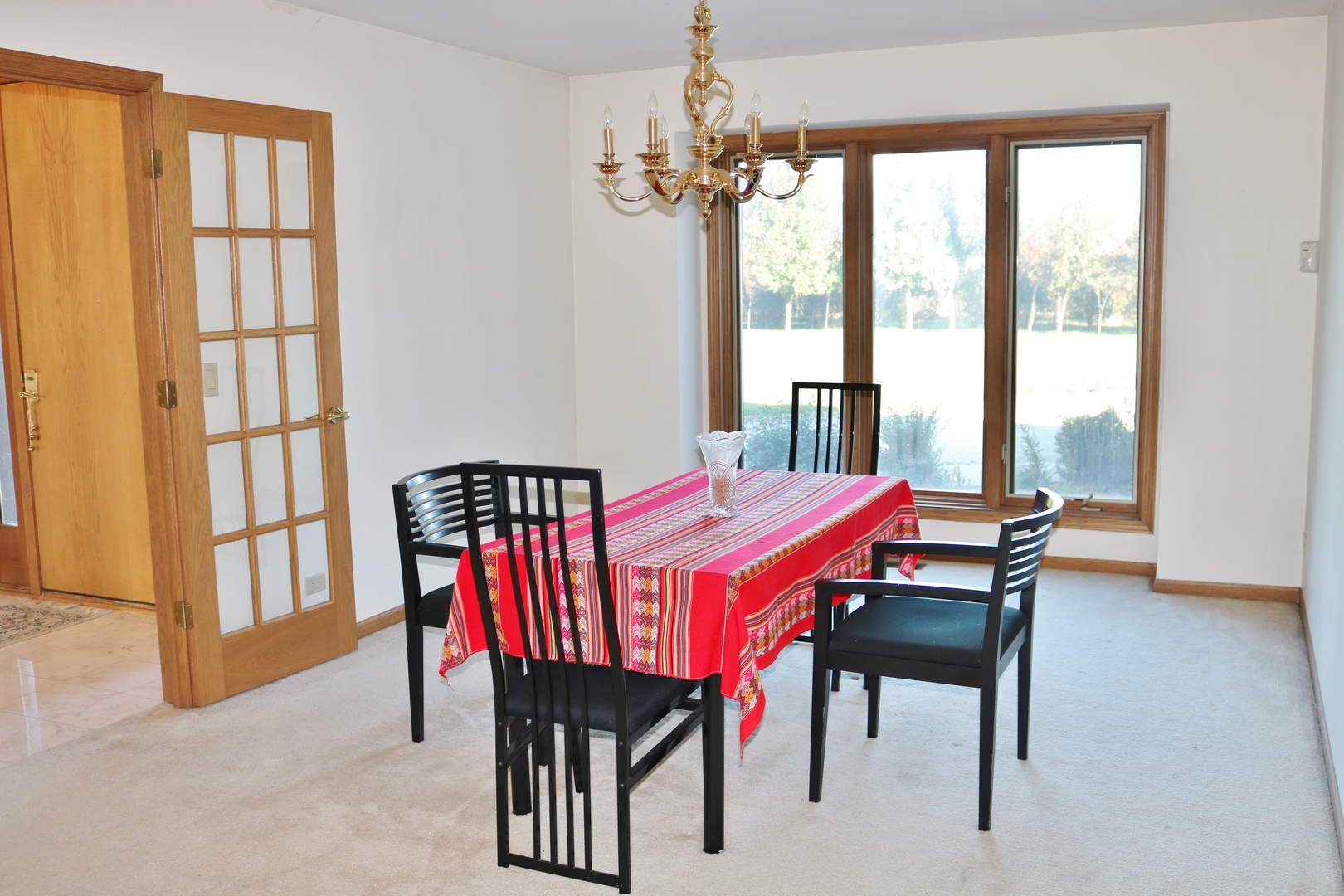 12232 Grove Road Minooka, IL 60447 - Photo 50 of 57 a view of a dining room with furniture large windows and wooden floor