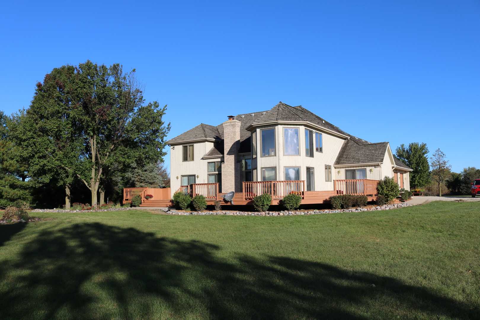 12232 Grove Road Minooka, IL 60447 - Photo 53 of 57 a front view of a house with a garden