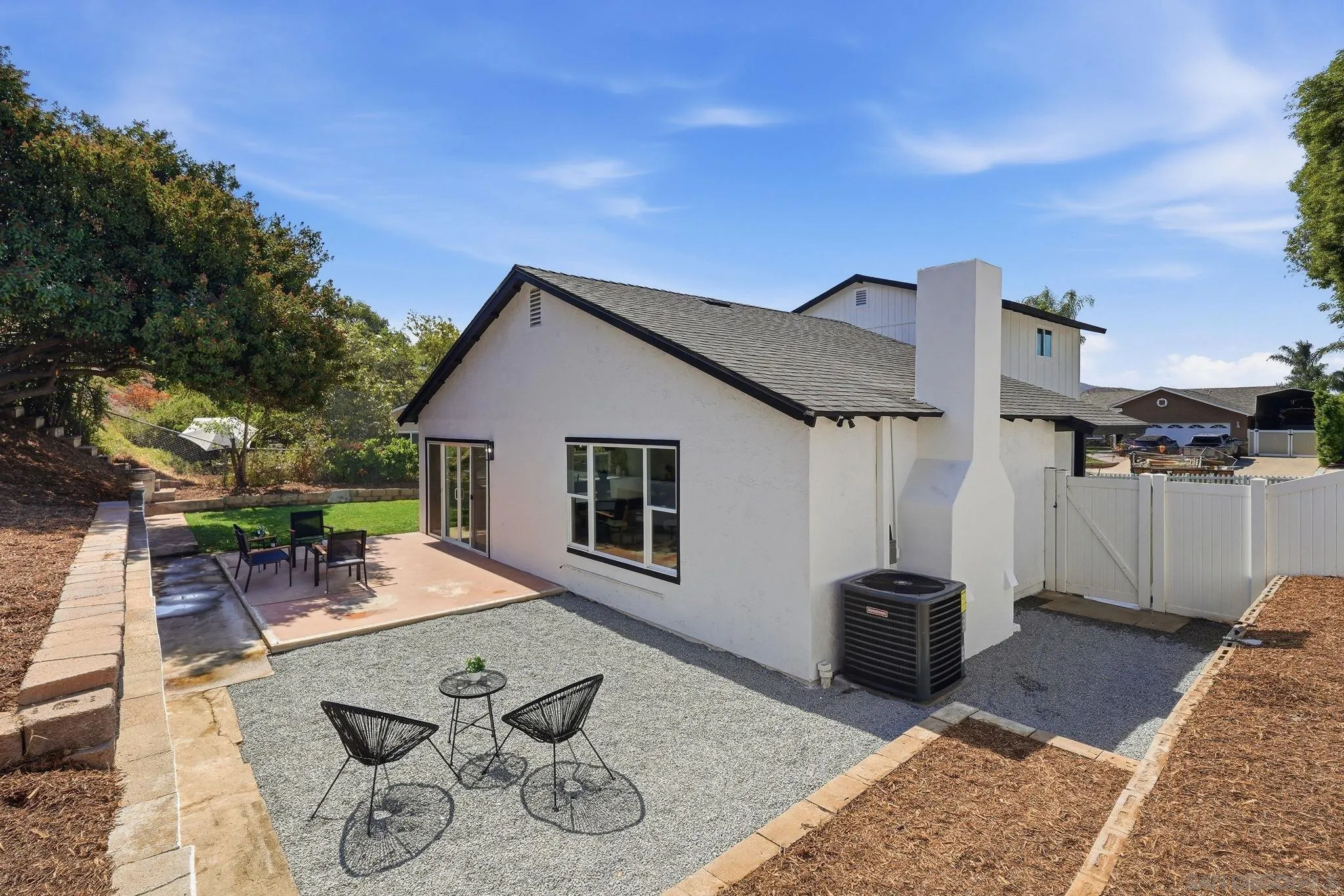 10440 Bosque Drive Lakeside, CA 92040 - Photo 47 of 47 a backyard of a house with table and chairs