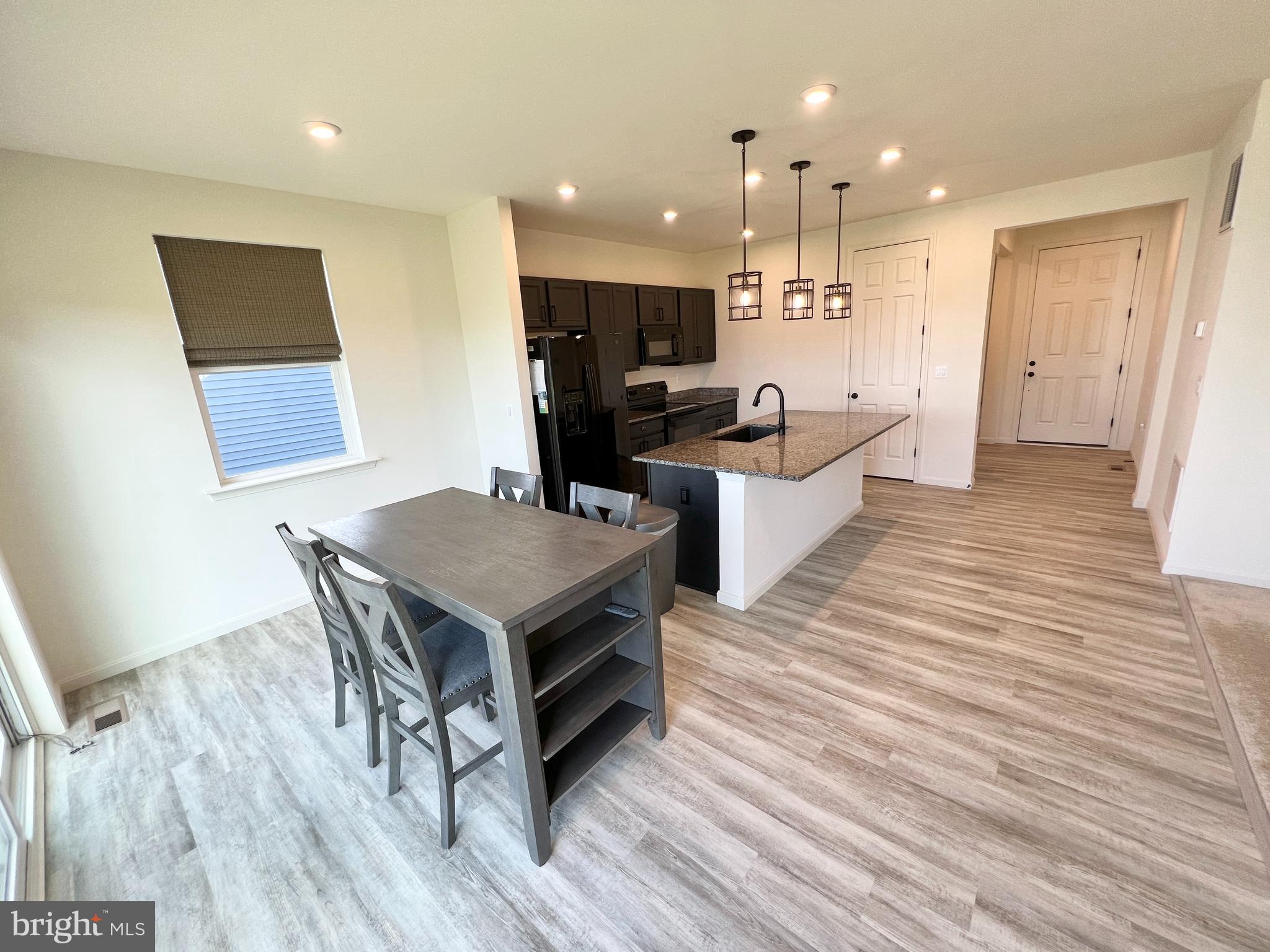 6366 Pointer Lane King George, VA 22485 - Photo 15 of 48 a kitchen with a table and chairs in it