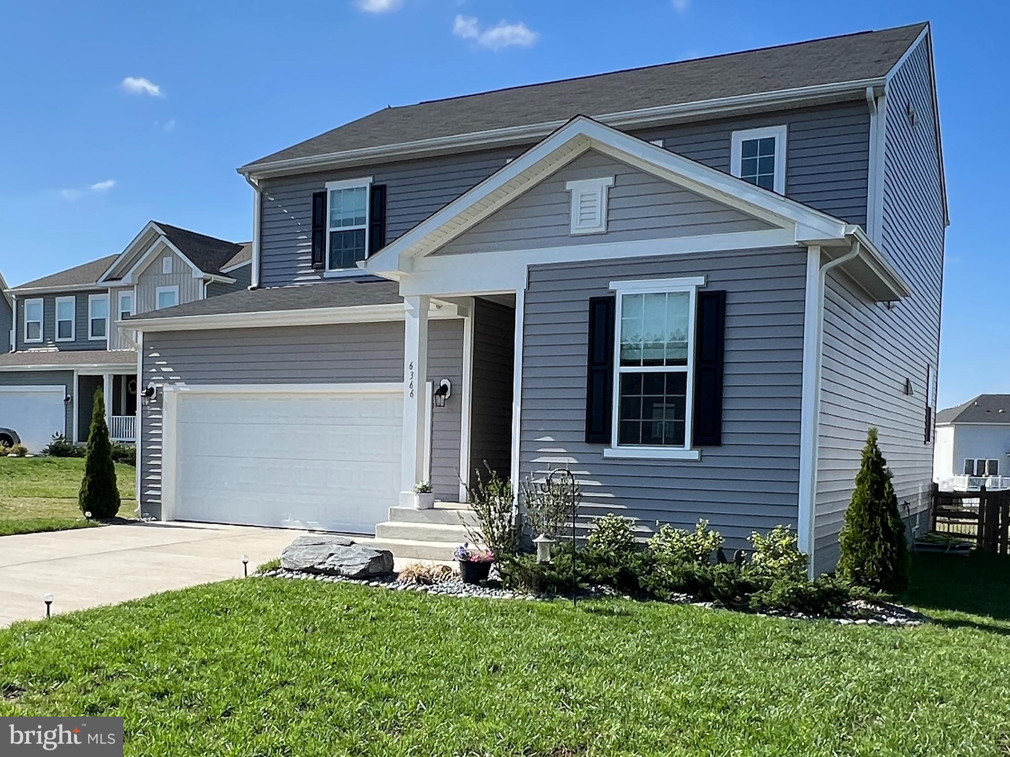6366 Pointer Lane King George, VA 22485 - Photo 2 of 48 a front view of a house with a yard and garage