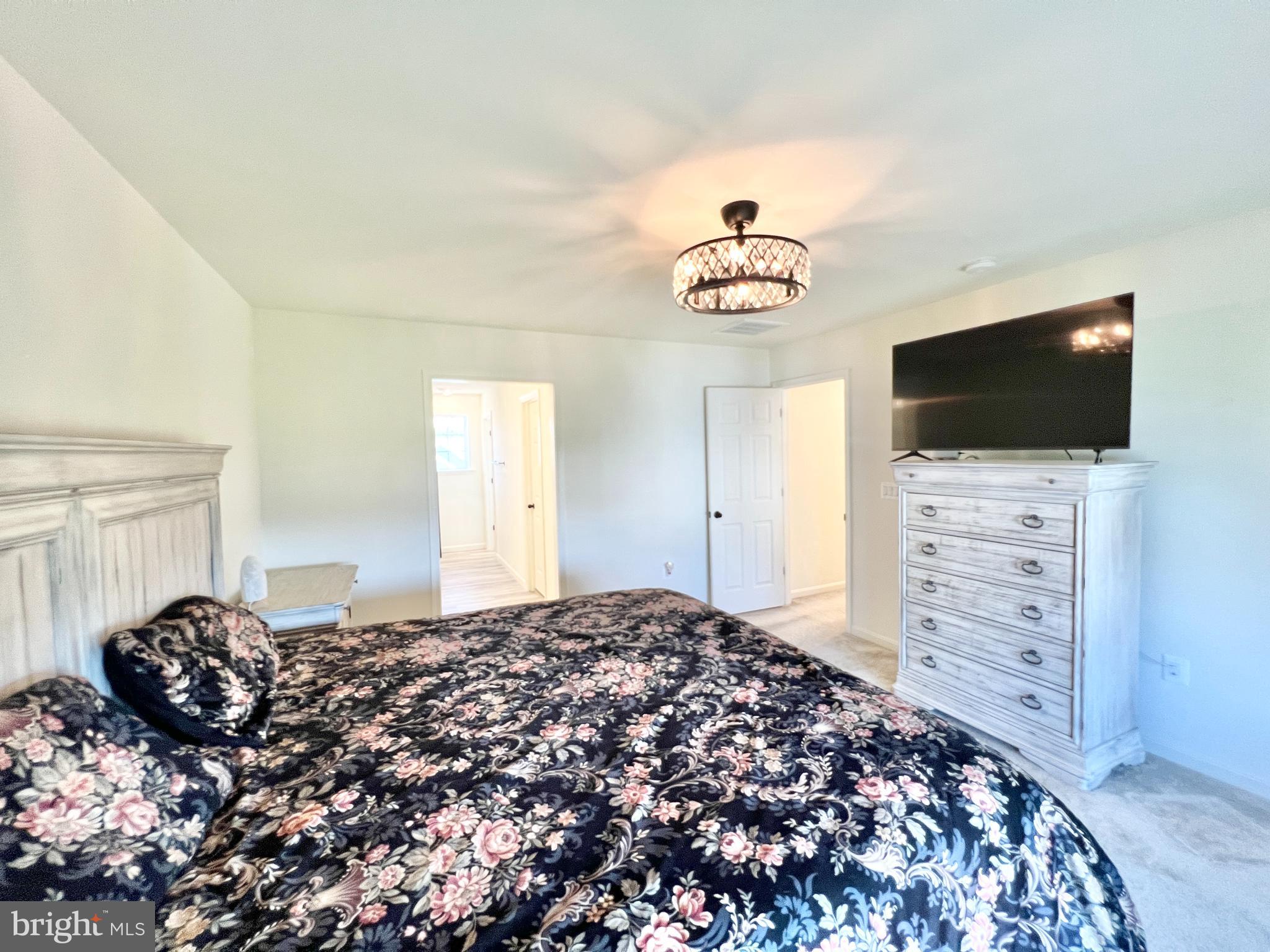 6366 Pointer Lane King George, VA 22485 - Photo 22 of 48 a bedroom with a bed and a flat screen tv