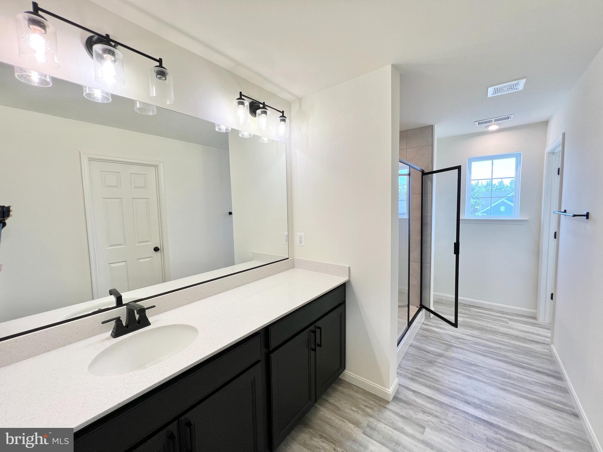 6366 Pointer Lane King George, VA 22485 - Photo 24 of 48 a bathroom with a sink double vanity and a mirror