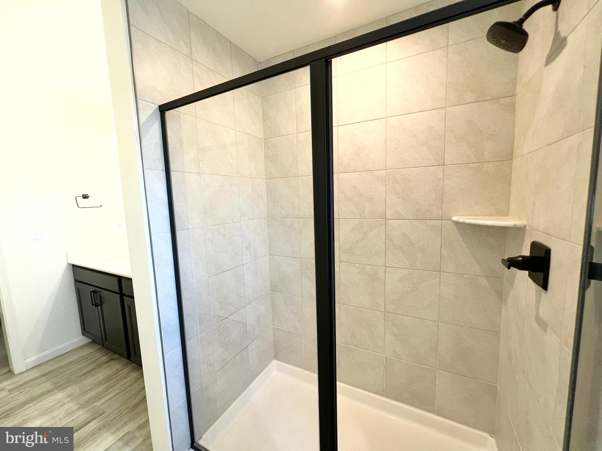 6366 Pointer Lane King George, VA 22485 - Photo 25 of 48 a bathroom with a glass shower door