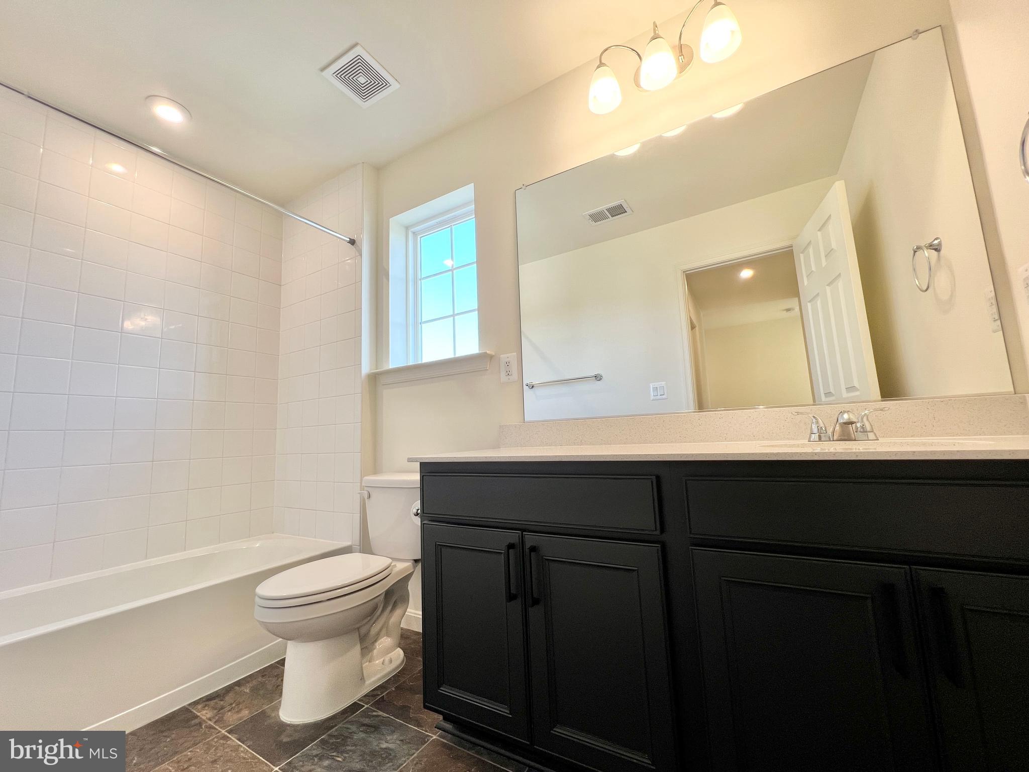 6366 Pointer Lane King George, VA 22485 - Photo 31 of 48 a bathroom with a sink vanity mirror and toilet