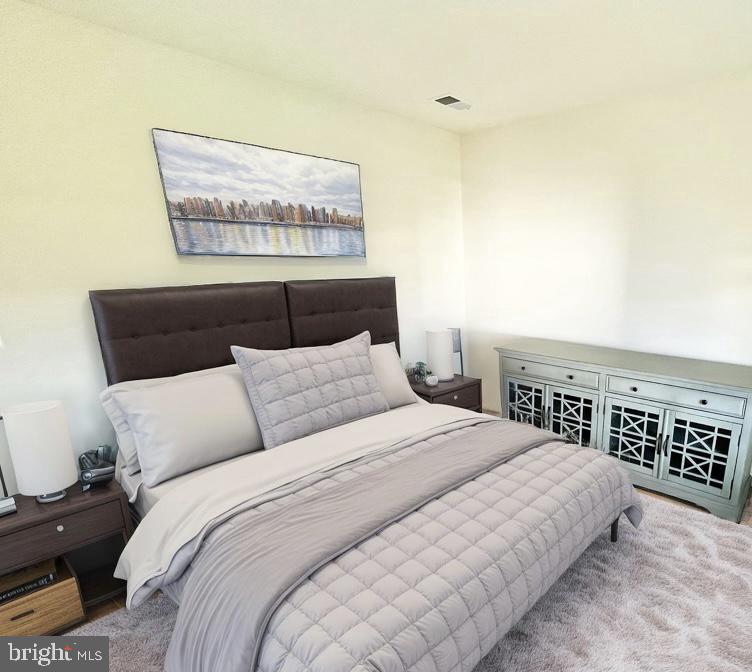 6366 Pointer Lane King George, VA 22485 - Photo 34 of 48 a bedroom with a bed and a night stand