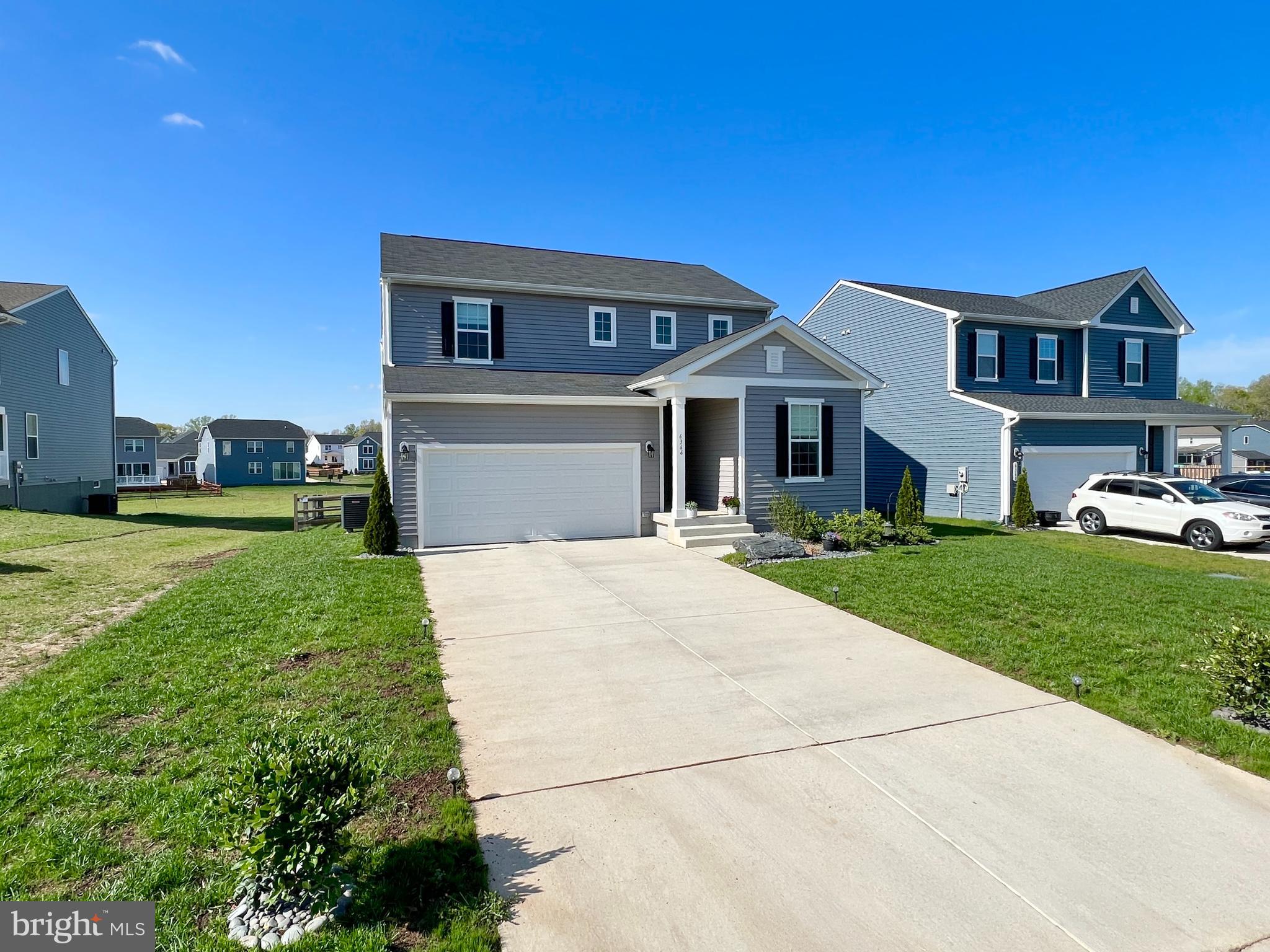 6366 Pointer Lane King George, VA 22485 - Photo 4 of 48 a front view of a house with a yard