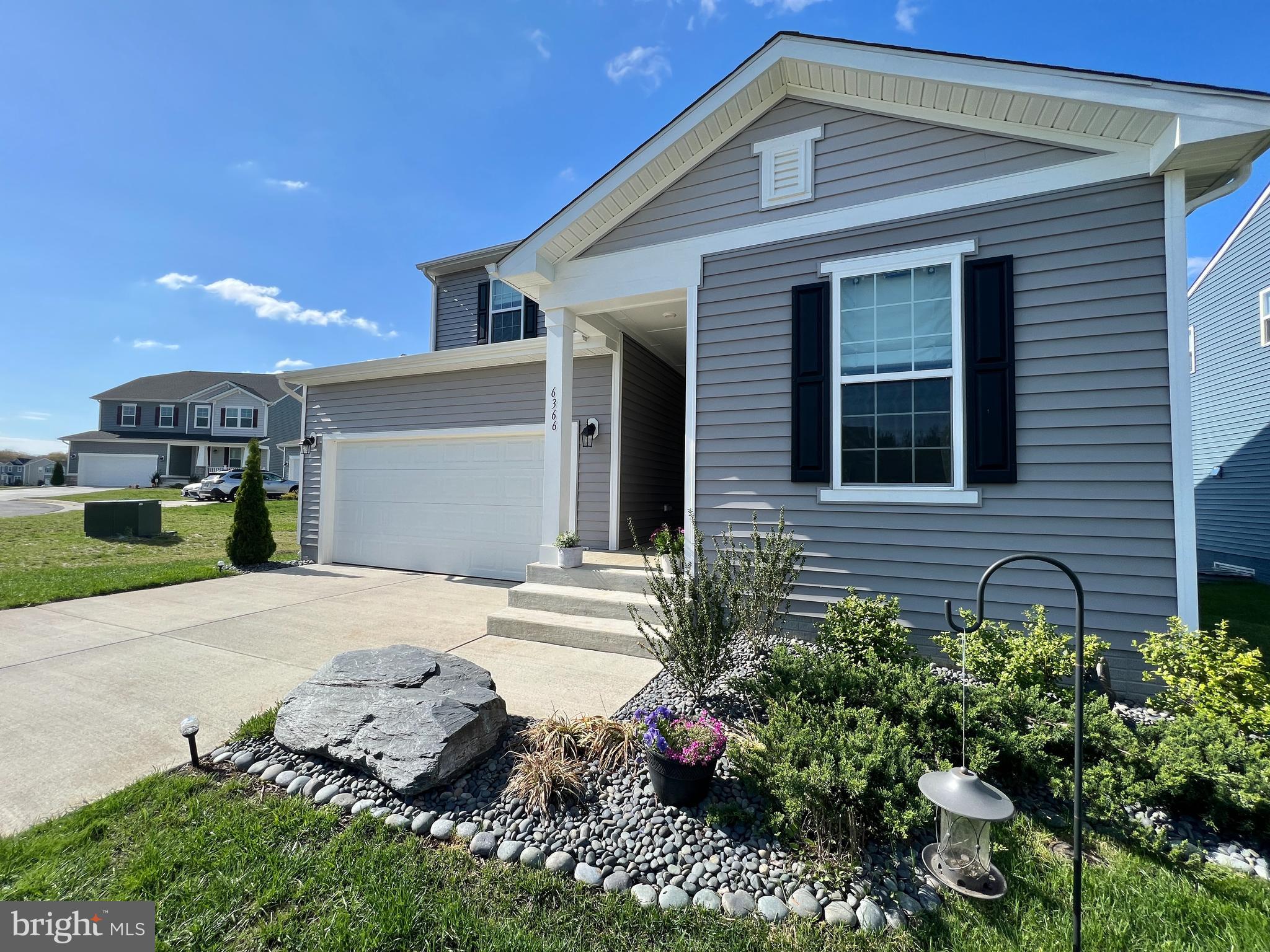 6366 Pointer Lane King George, VA 22485 - Photo 5 of 48 a front view of a house with a yard and garage
