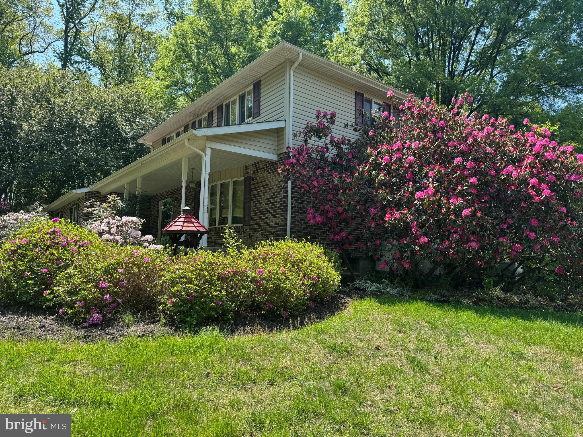 6008 Fork Woods Road Baldwin, MD 21013 - Photo 4 of 12 a front view of a house with a garden
