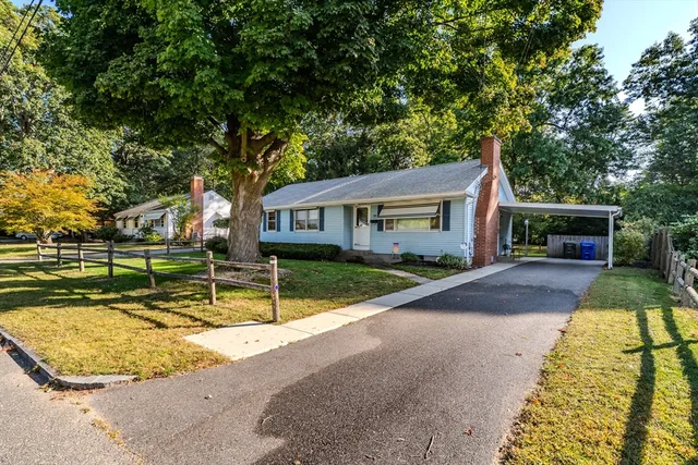 a view of house with swimming pool outdoor seating