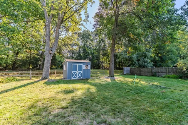 a swimming pool with trees in the background