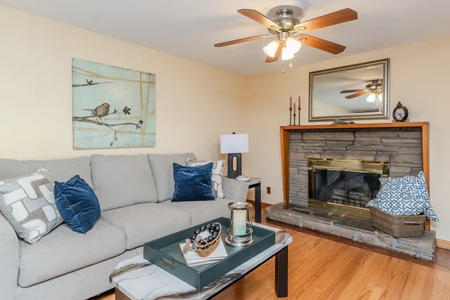 a living room with furniture and a fireplace