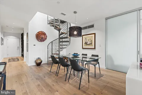 a view of a dining area with furniture and a clock