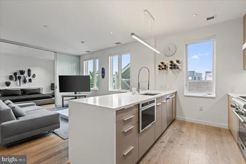 a kitchen with a stove and a microwave