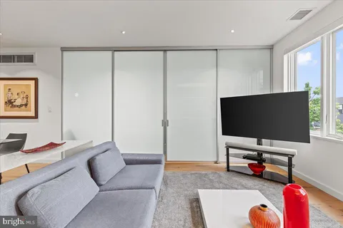 a living room with furniture and a table