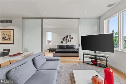 a bedroom with bed and window