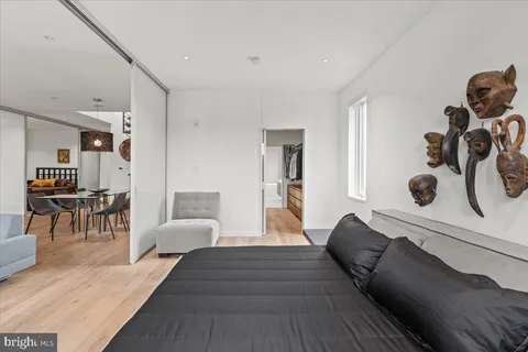 a bedroom with furniture and a window