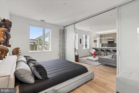 a view of walk in closet with clothes