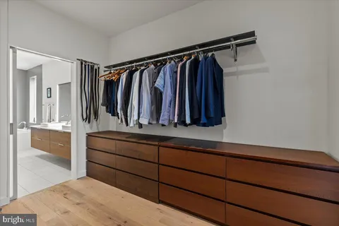 a view of a walk in closet and bedroom
