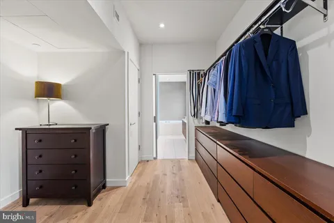 a large bathroom with a large tub shower and sink