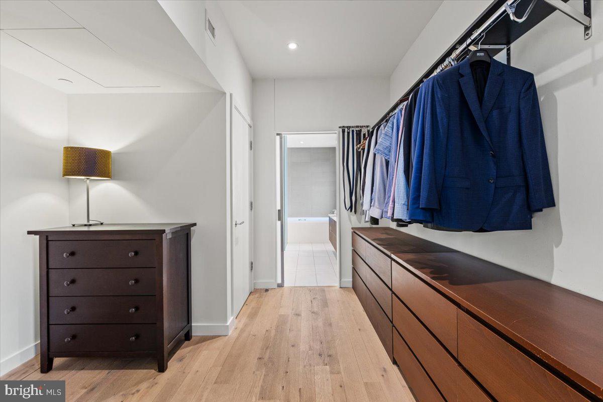 1932 9th Street Northwest, Unit 402 Washington, DC 20001 - Photo 25 of 42 a view of a walk in closet and bedroom