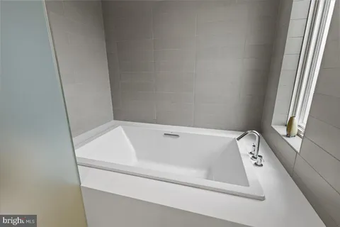 a view of a hallway with seating area