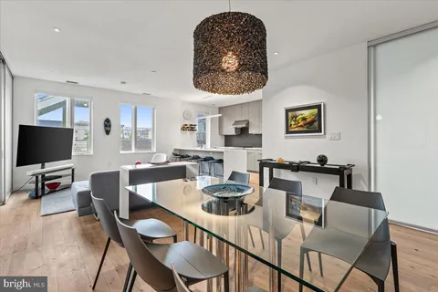 a kitchen with a stove a sink and a refrigerator