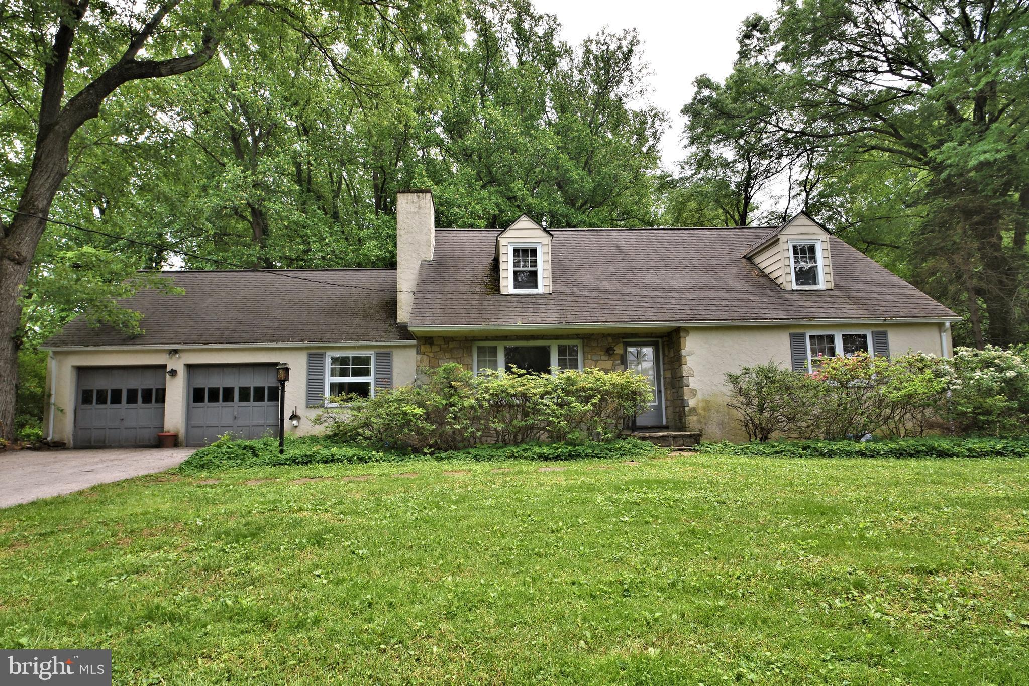 70 Old State Road Devon, PA 19333 - Photo 1 of 20 a front view of house with yard and green space