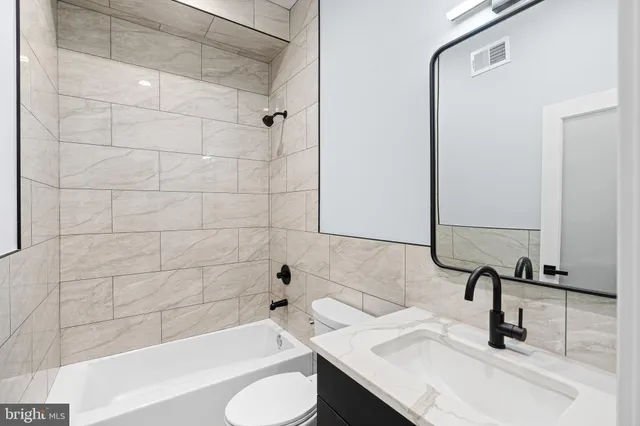 a bathroom with a sink and a bathtub