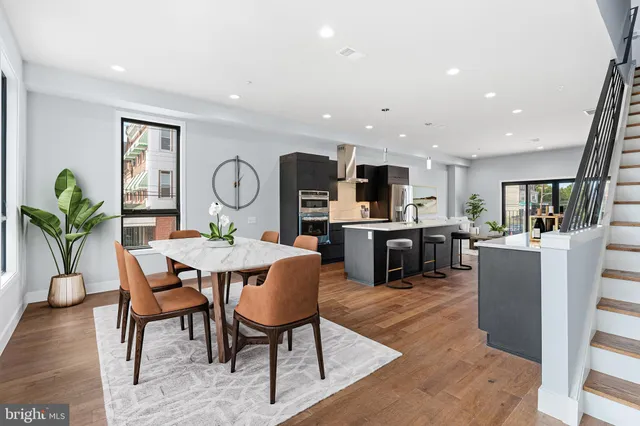 a view of a dining room with furniture window and wooden floor