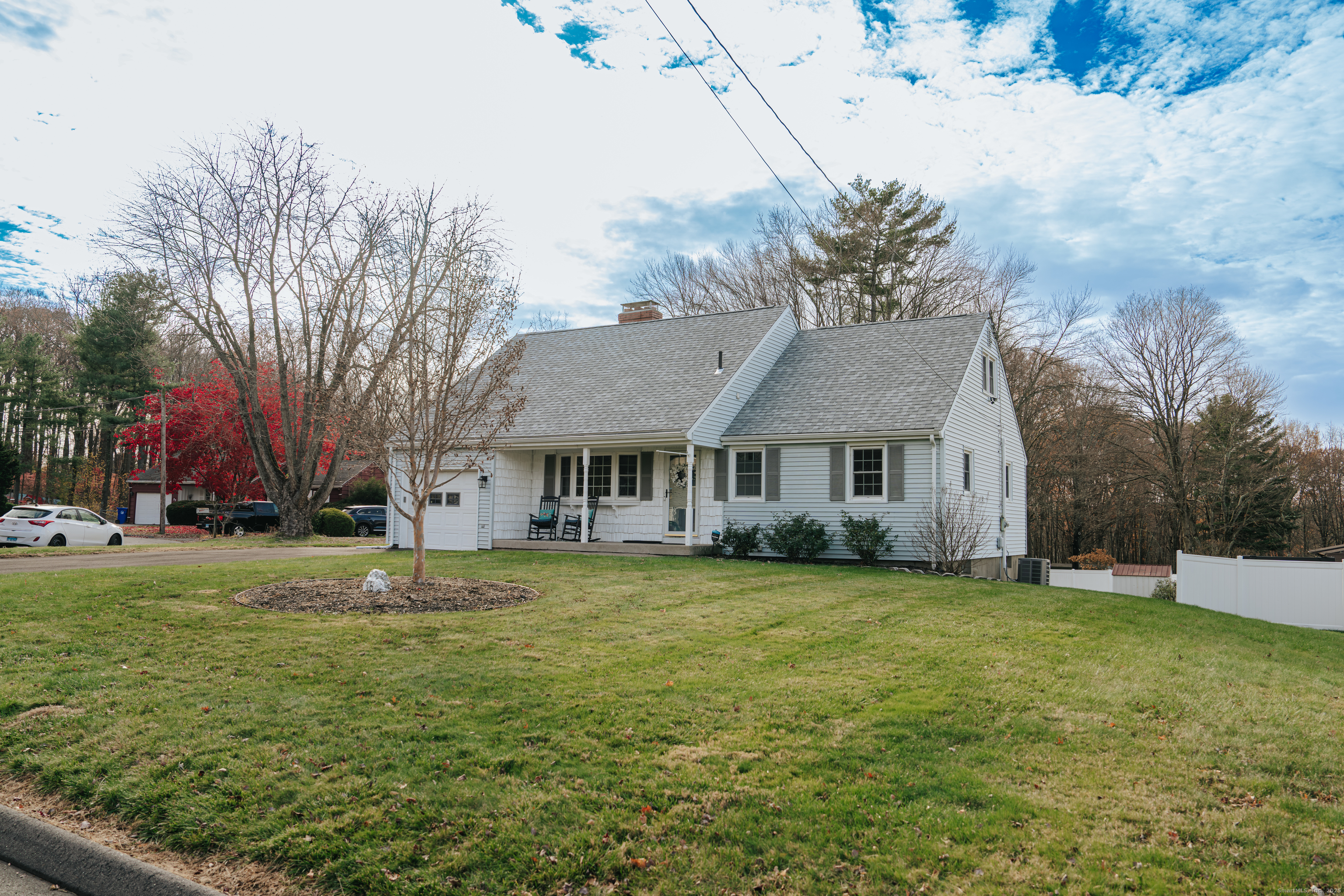 a big house with a big yard and large trees
