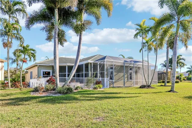 a spacious bathroom with a tub sink and a large mirror