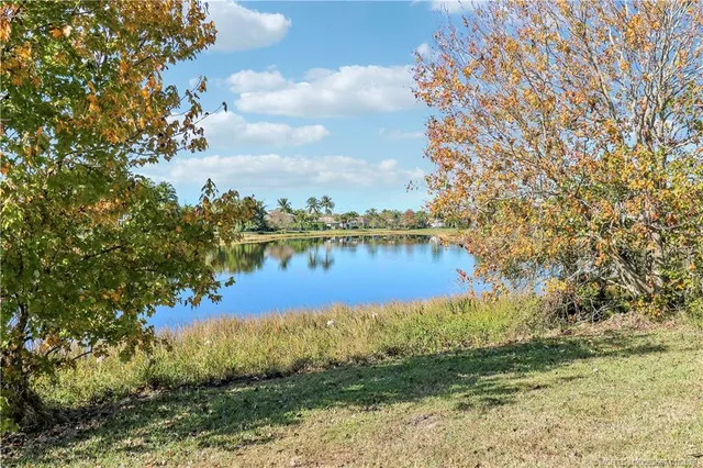 a living room with furniture and a book shelf