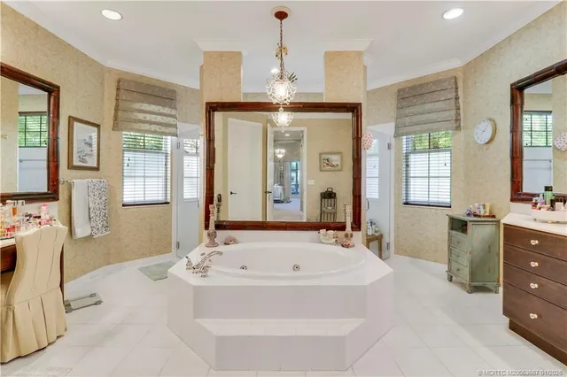a bathroom with a sink double vanity and a mirror