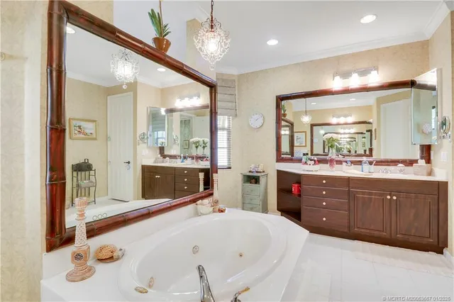 a bedroom with a large bed mirror and a furniture