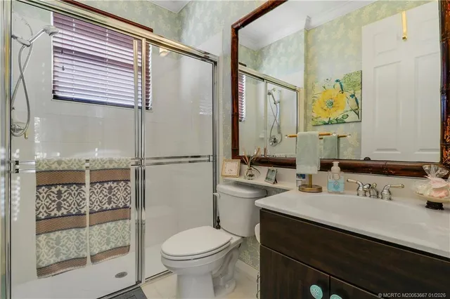 an aerial view of a residential houses with city view