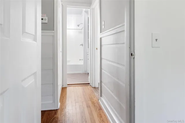 a view of a bathroom from the hallway