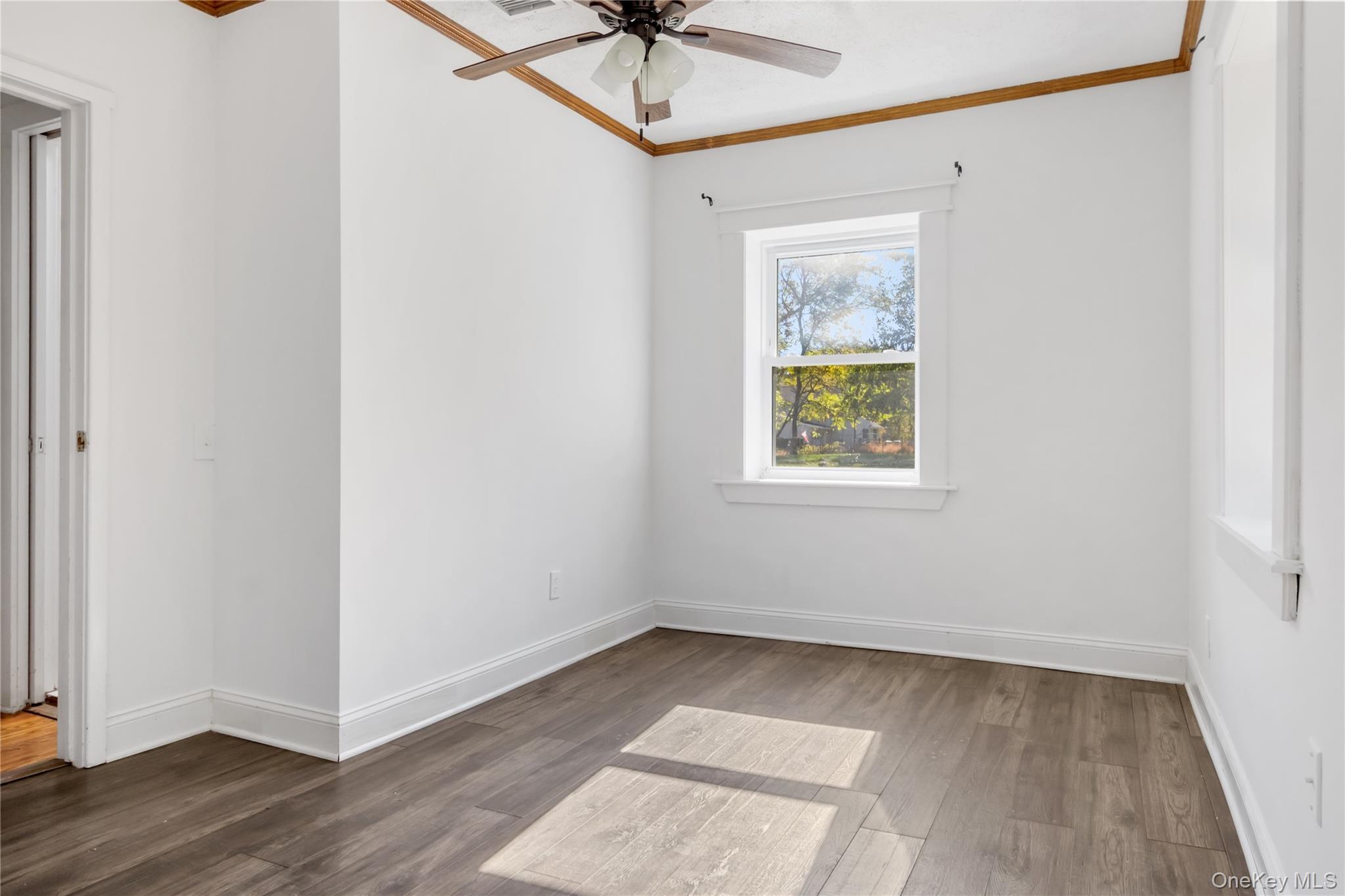 13 Strack Road Goshen, NY 10924 - Photo 13 of 22 a view of an empty room with a window and wooden floor