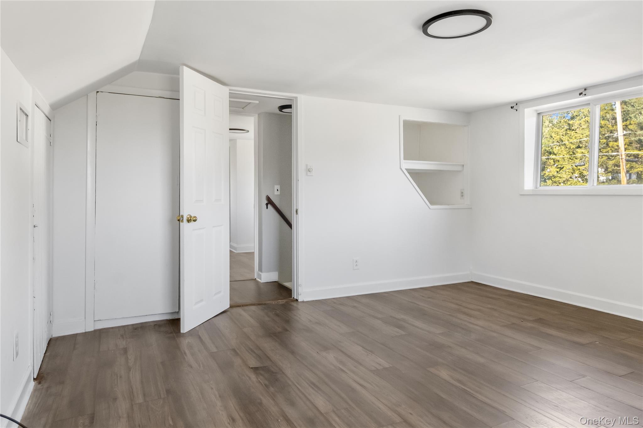 13 Strack Road Goshen, NY 10924 - Photo 17 of 22 a view of an empty room with wooden floor and a window