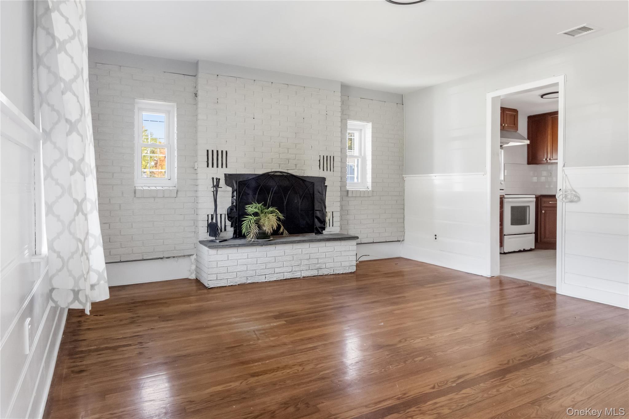 13 Strack Road Goshen, NY 10924 - Photo 2 of 22 a living room with furniture and a fireplace