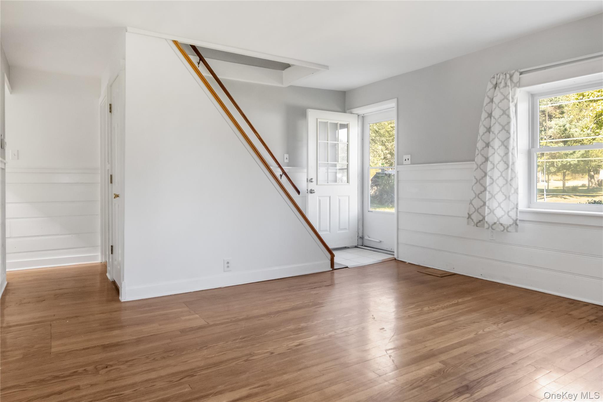 13 Strack Road Goshen, NY 10924 - Photo 5 of 22 an empty room with wooden floor and windows