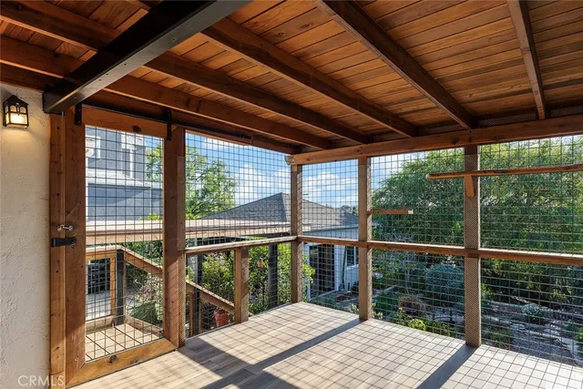 a area with wooden floor and glass door