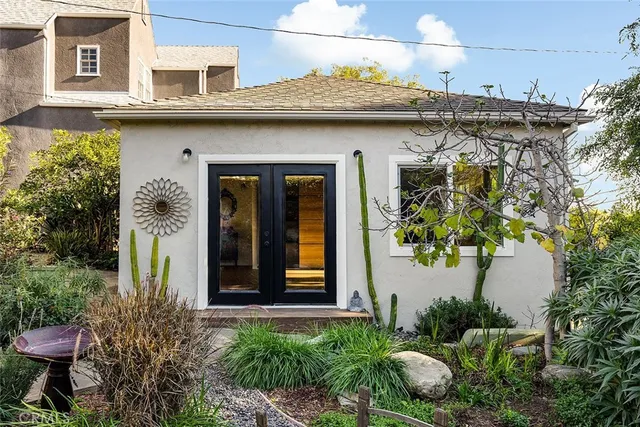 a front view of a house with garden