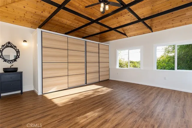 a view of a house with potted plants
